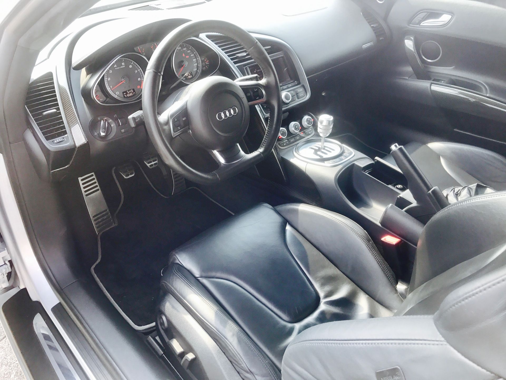The interior of an Audi sports car is shown