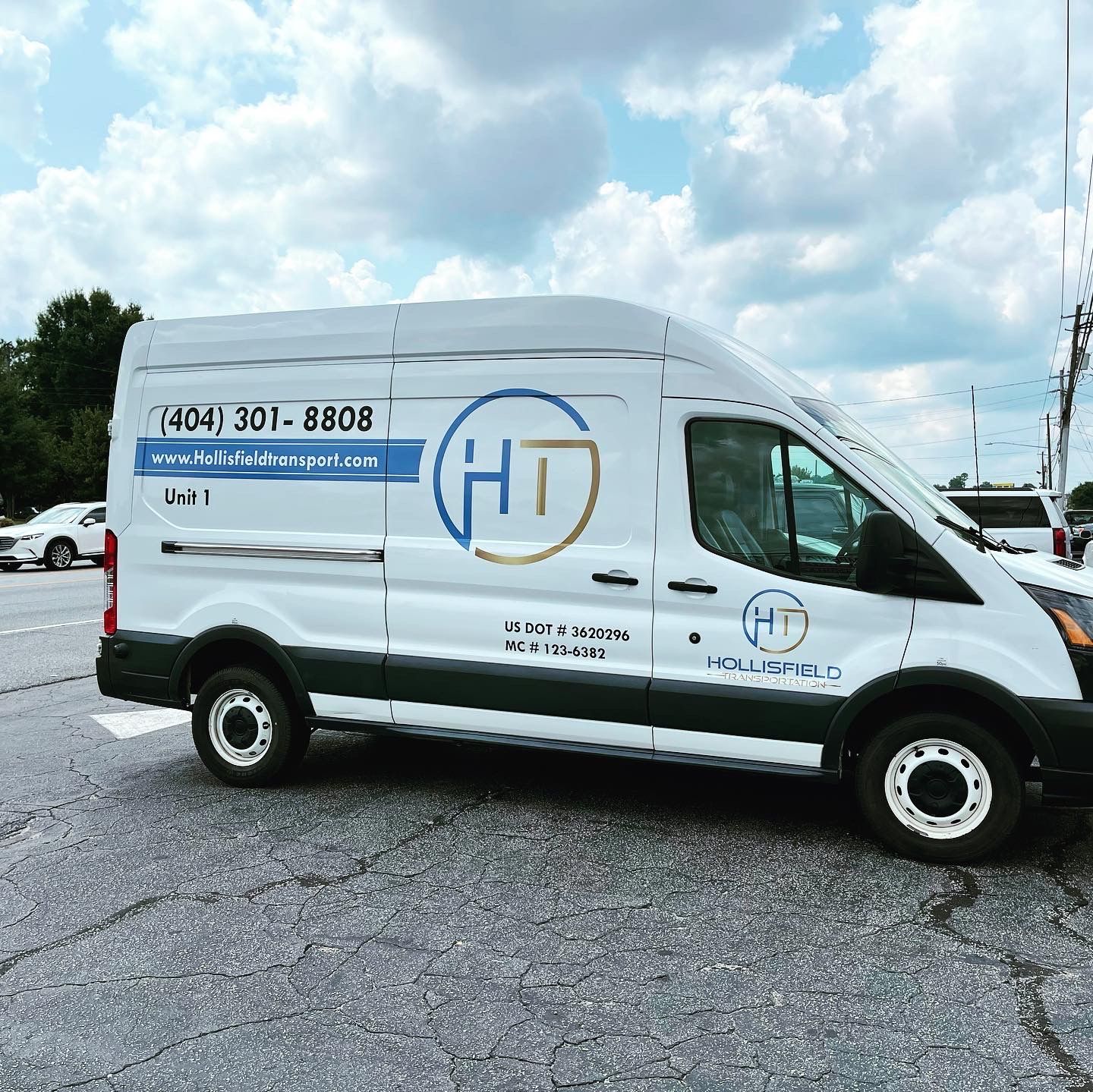 A white van with the word HT on it