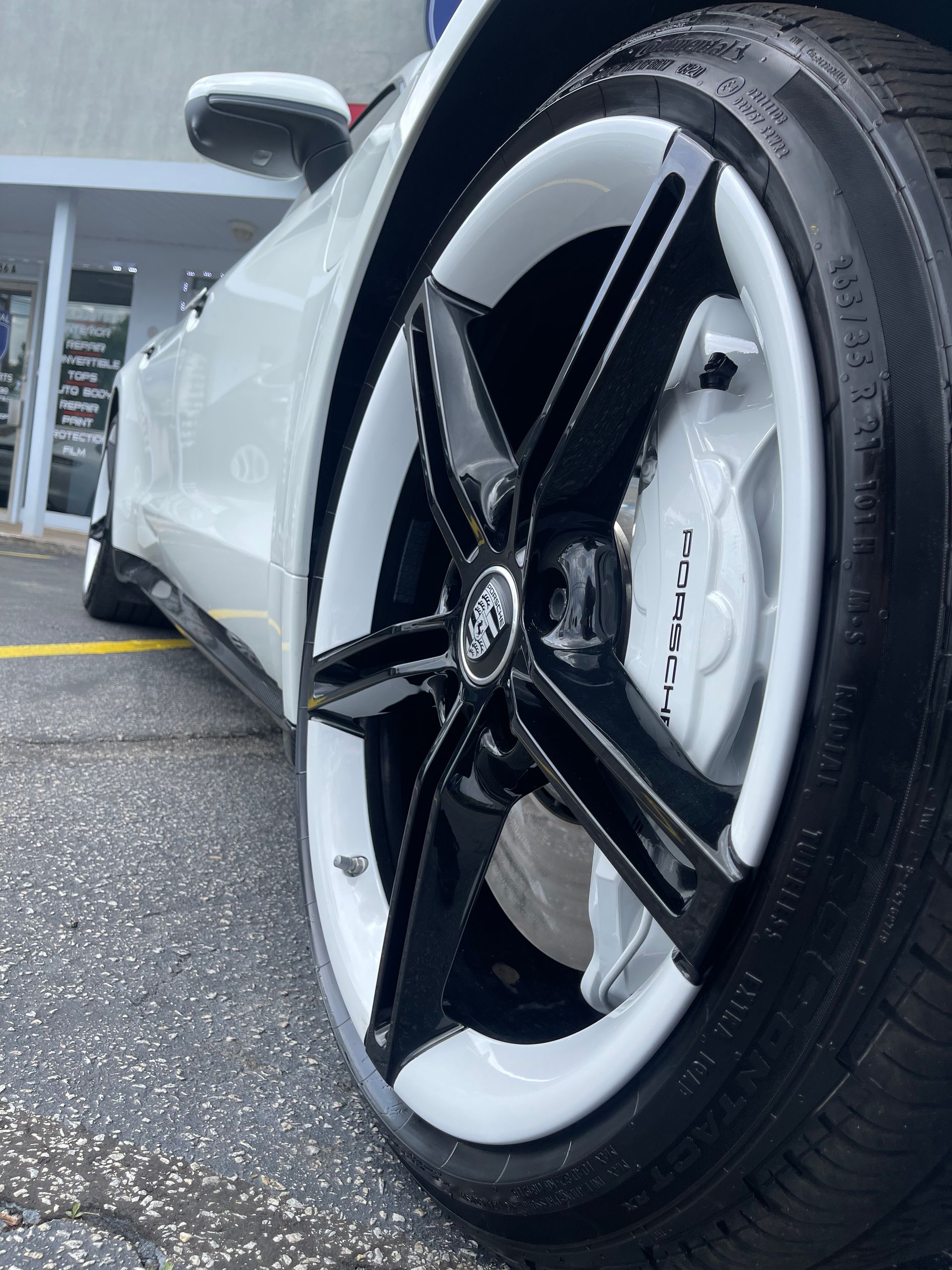 A close up of a car's wheel and tire