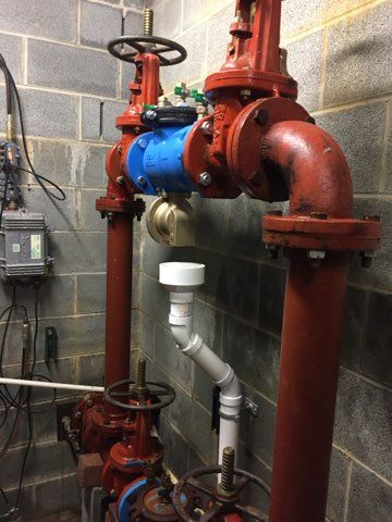 a bunch of pipes are connected to each other in a room