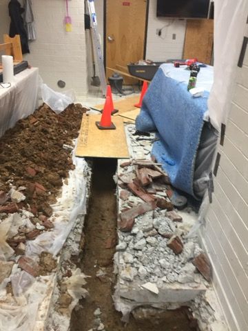 a trench in the ground for laying a pipe