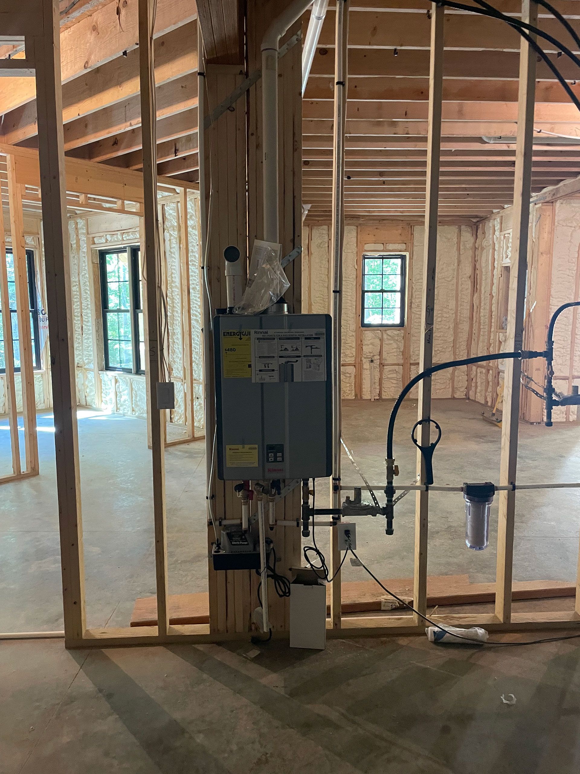 An empty room with a heater in the middle of it