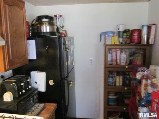A kitchen with the word rmlsa on the wall