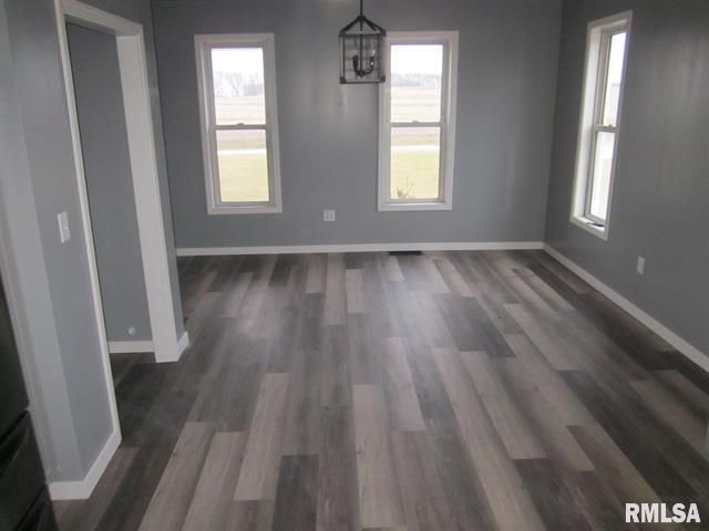 An empty room with a rmlsa sign on the wall