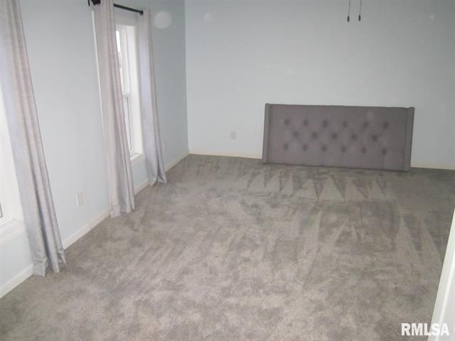 There is a bed in the middle of the room.