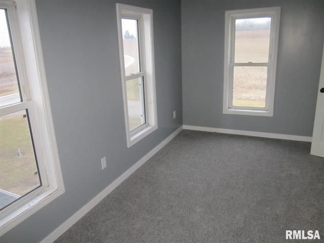 An empty room with a rmlsa logo on the bottom