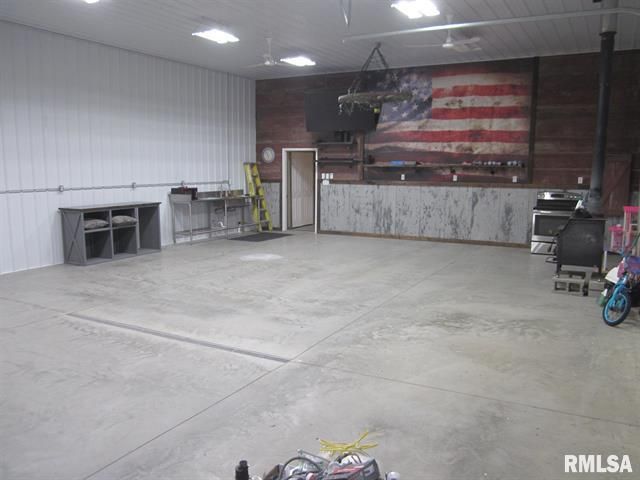 An empty garage with an american flag on the wall