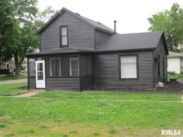 Black two-story house with a screened-in porch