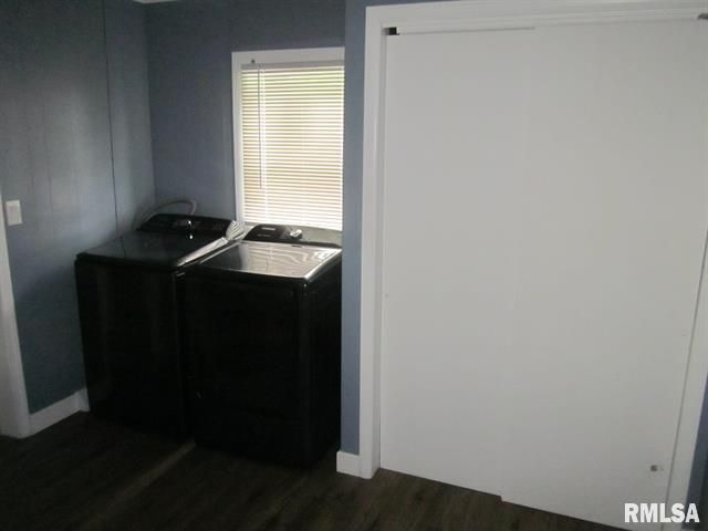 Laundry room with dark washer and dryer