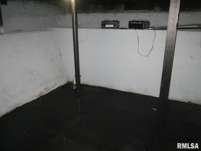 Basement with black-painted floor, white walls