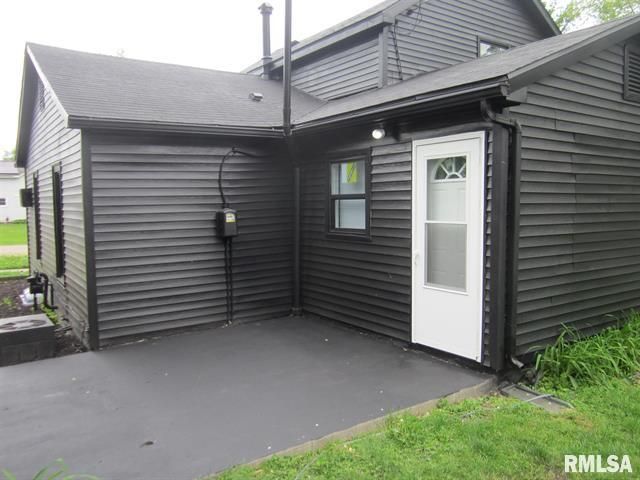 Black house with a white door