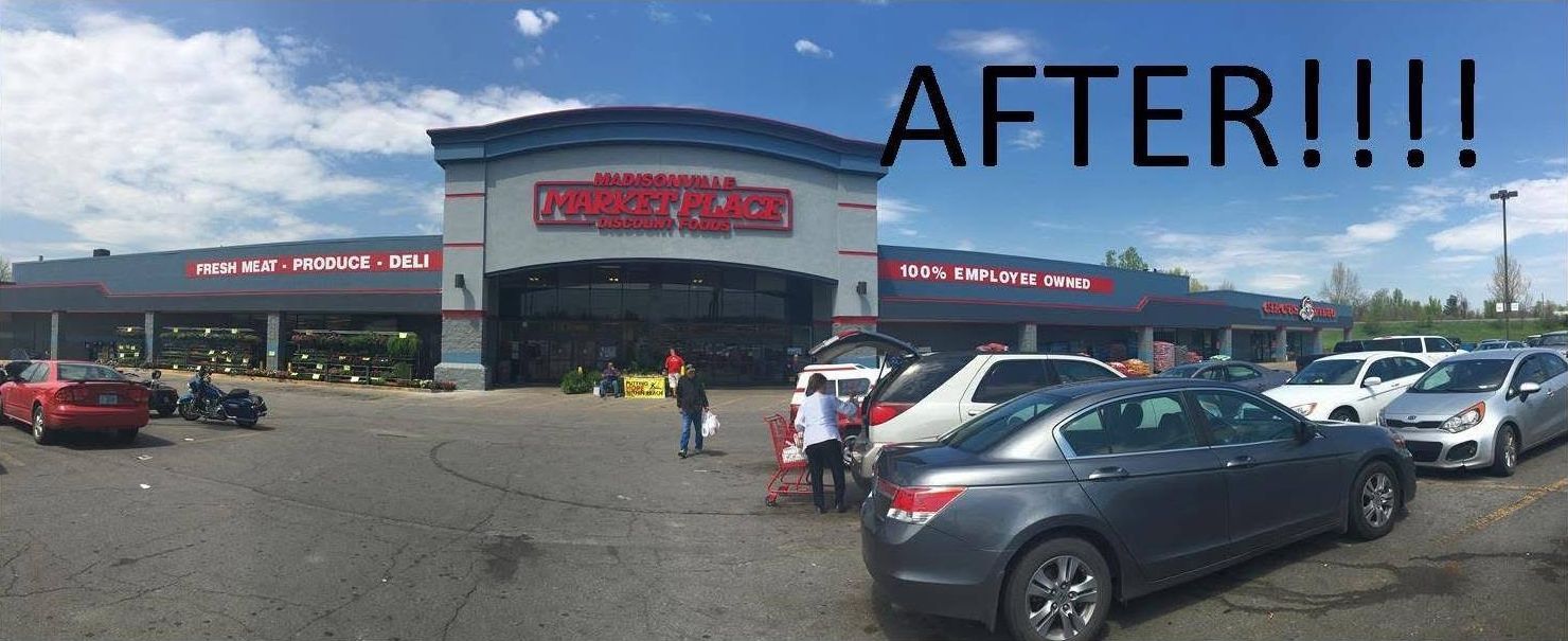 Cars parked in front of a HomeGoods store with a