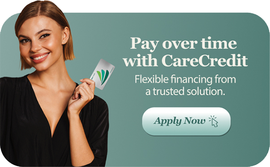Woman holding cards beside text: “Pay over time with CareCredit” and “Apply Now” on green background.
