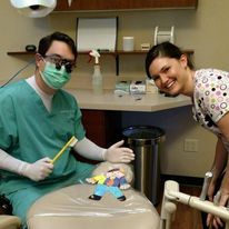 Dentist and assistant