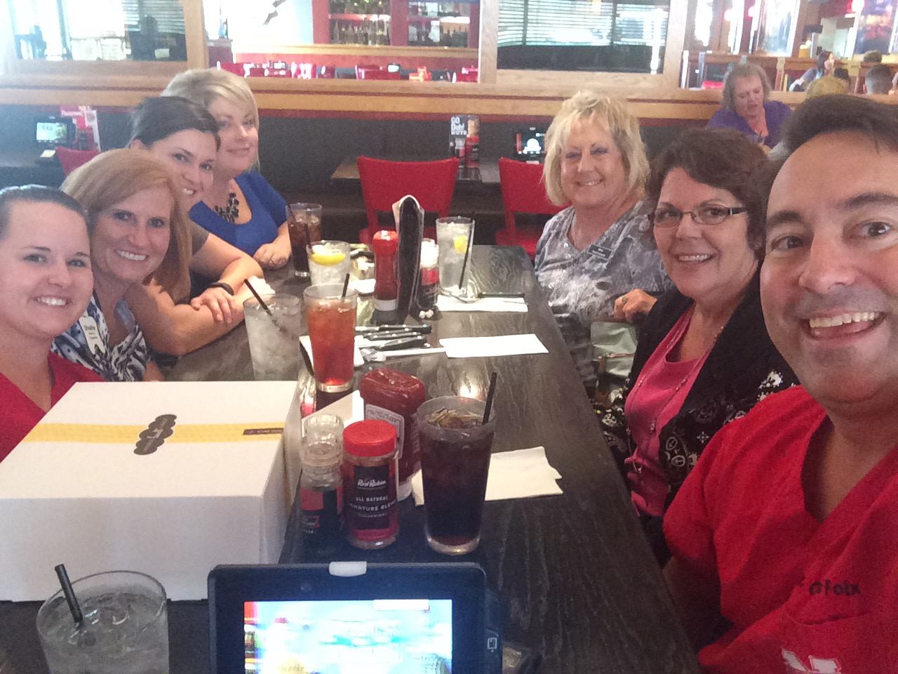 Shadow Lake Family and Cosmetic Dentistry staff in a restaurant