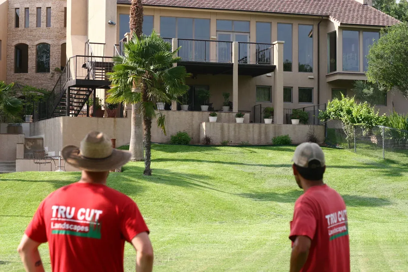 Two men in red shirts with 