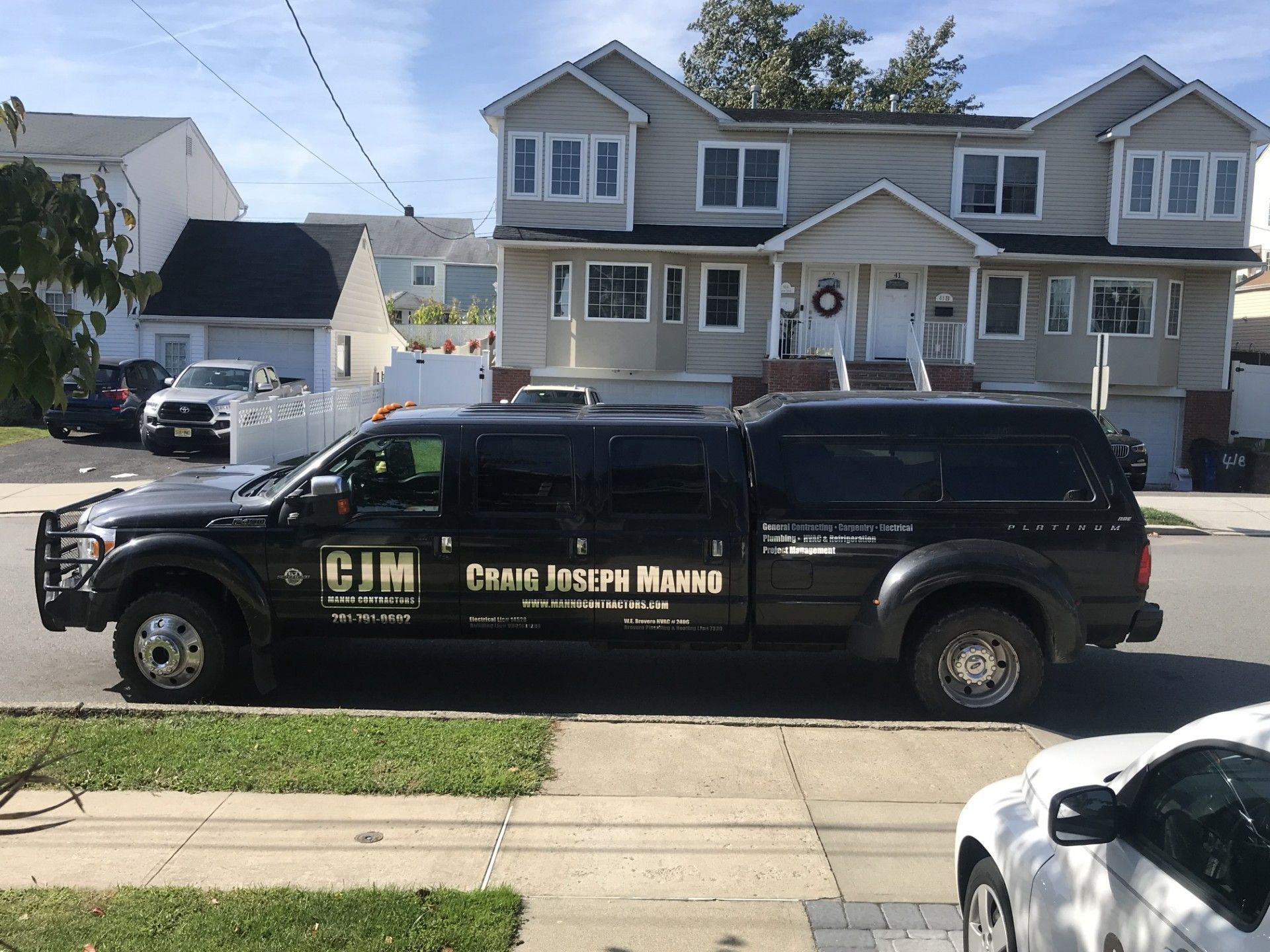 A black, extended-cab pickup truck with 