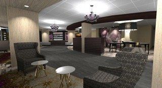 Lounge area with seating, small tables, and decorative lighting. Dark colors dominate the space.