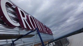 Sign on a building rooftop, the word 