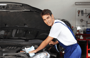 Mechanic checking the car engine