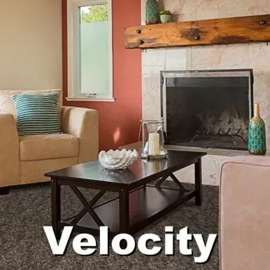 Living room with beige furniture, fireplace, dark coffee table, red wall, and