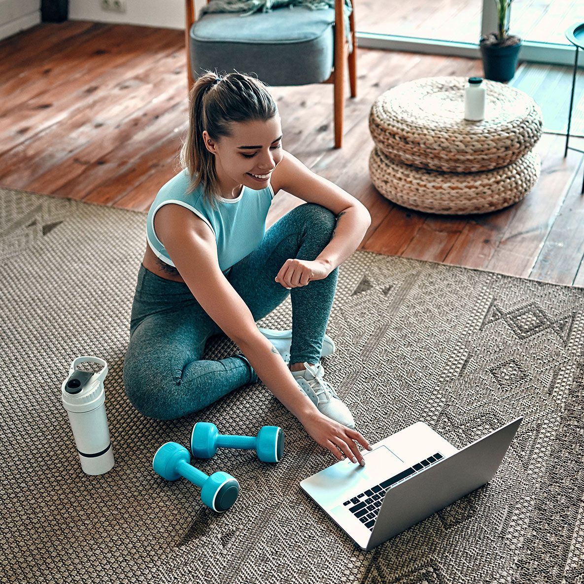 girl working out thru a laptop