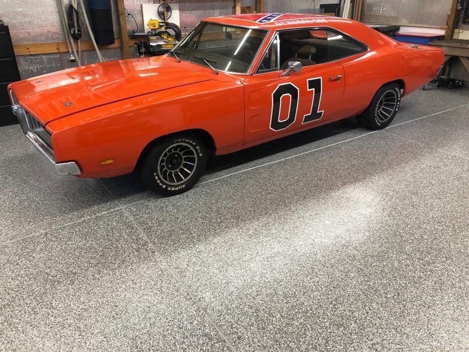 Red car in a garage concrete floor