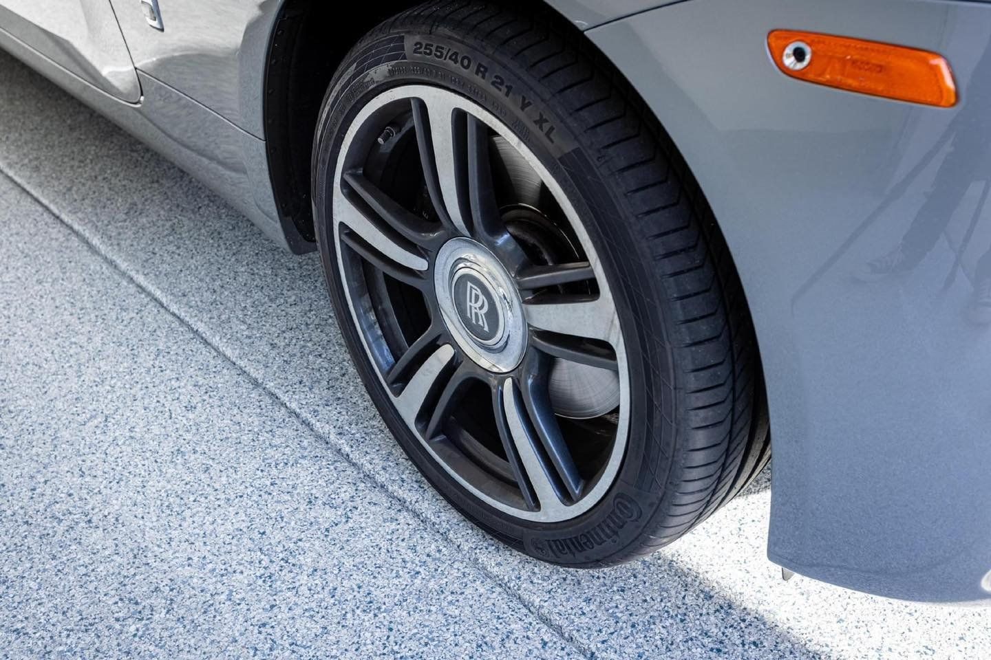Gray car in a coated garage floor