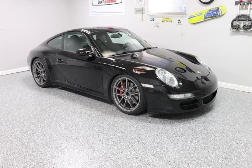 Black sports car in a garage