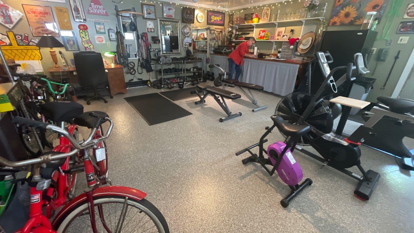 Gym equipment in a garage