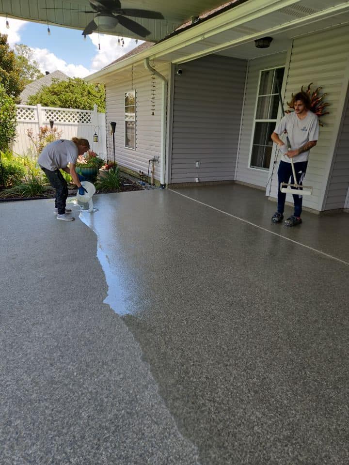 Patio floor being coated