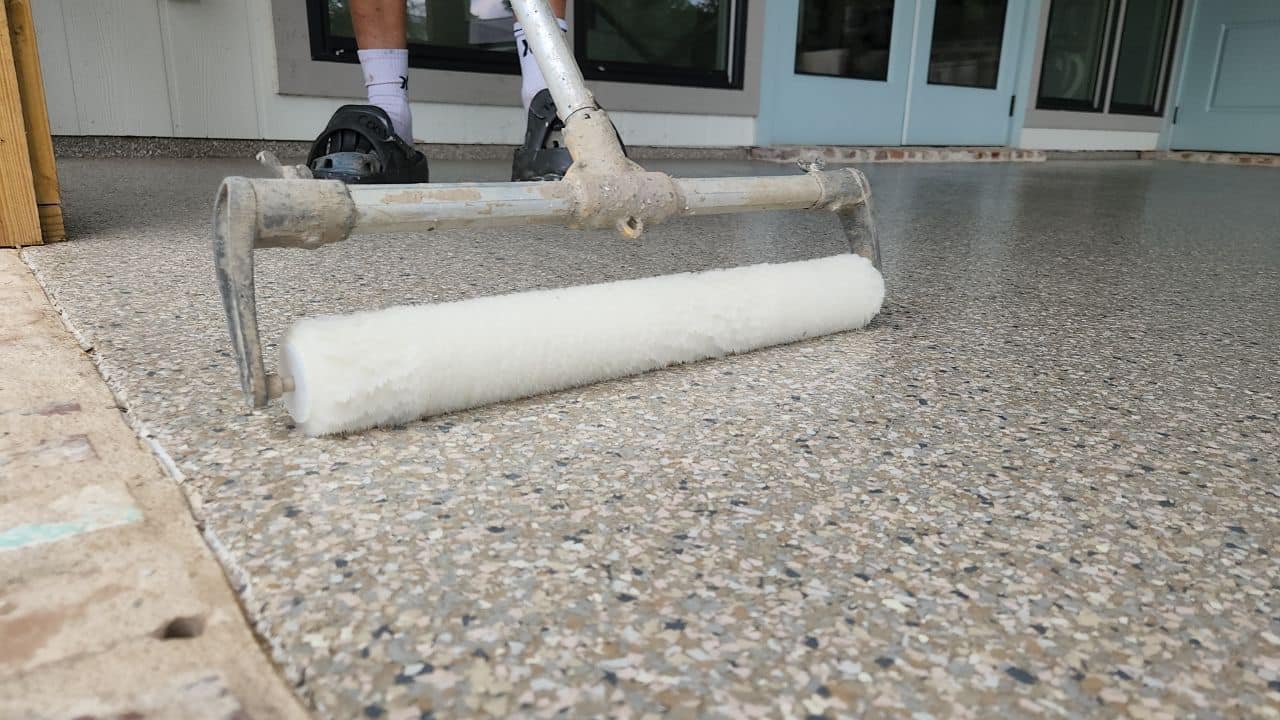 Patio floor being coated