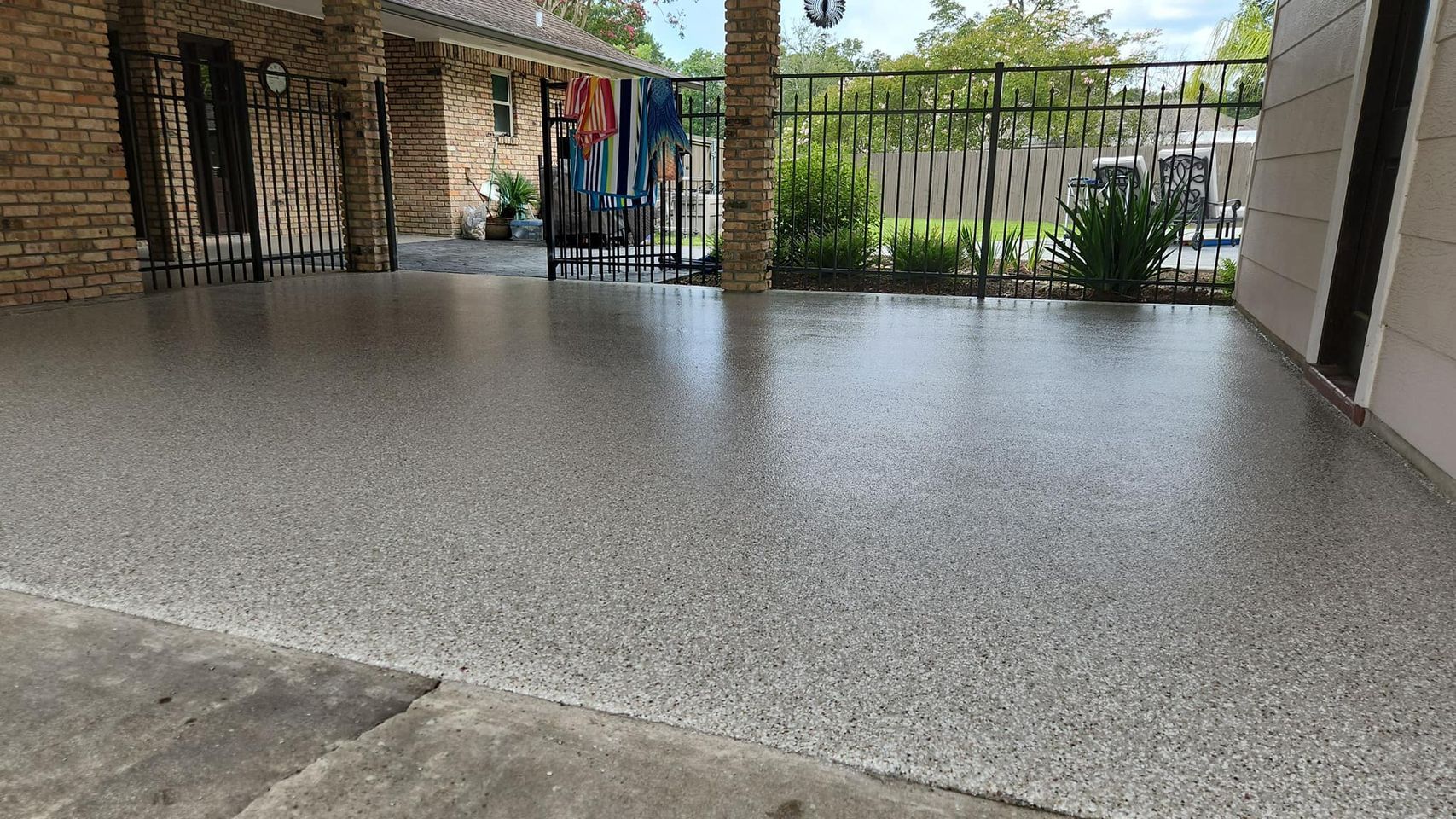Coated concrete flooring