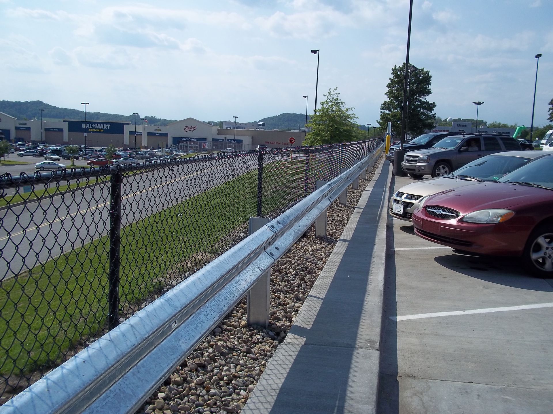 A lot of cars are parked in a parking lot