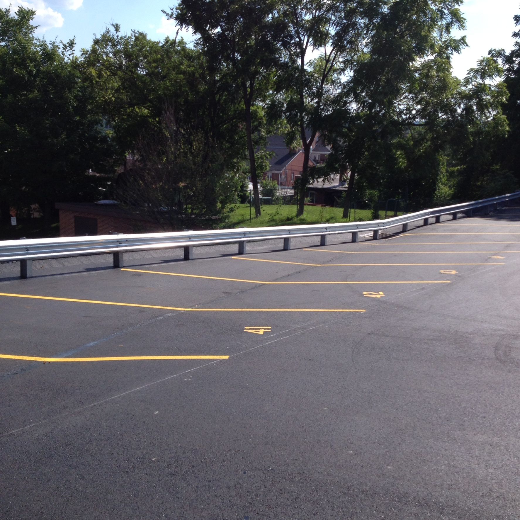 A parking lot with a handicapped sign on the side