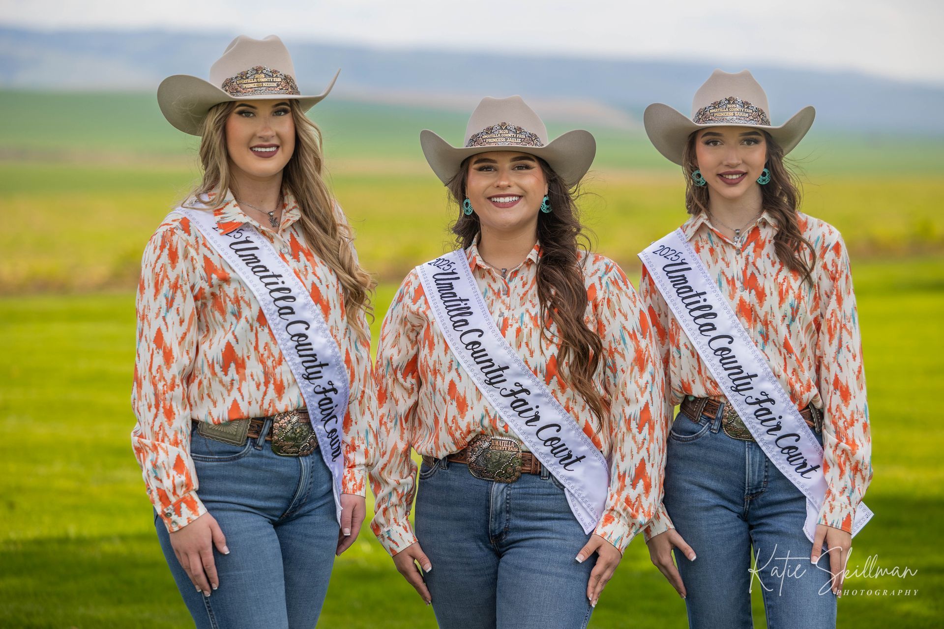 a group of young women wearing sashes are posing for a picture