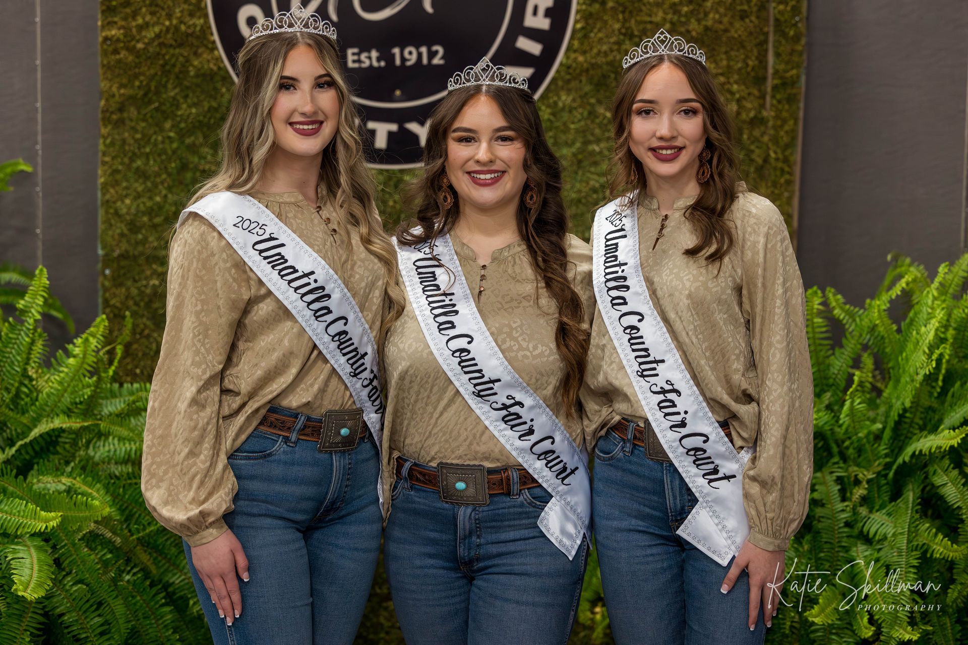 a group of young women wearing sashes are posing for a picture