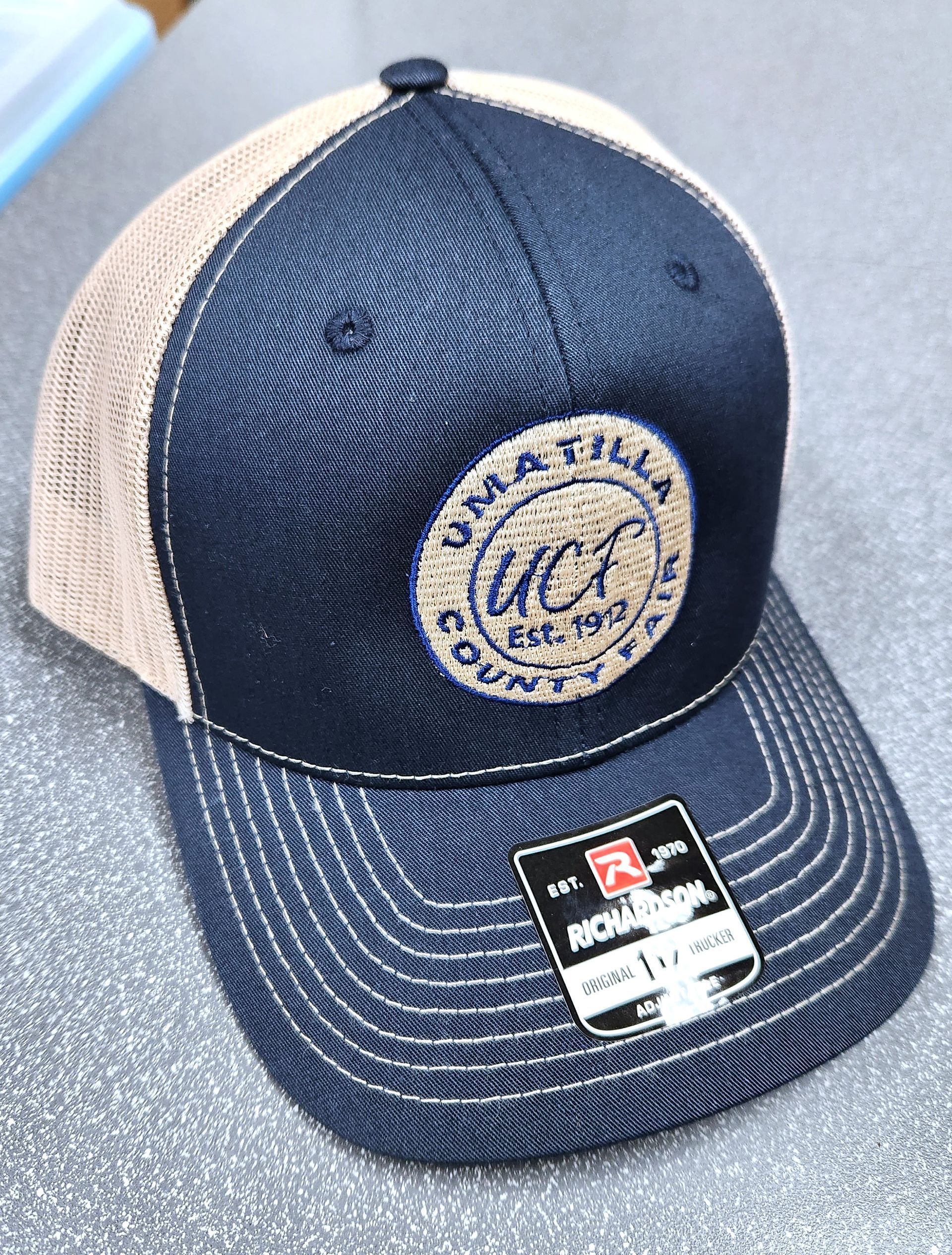 a black and tan baseball cap