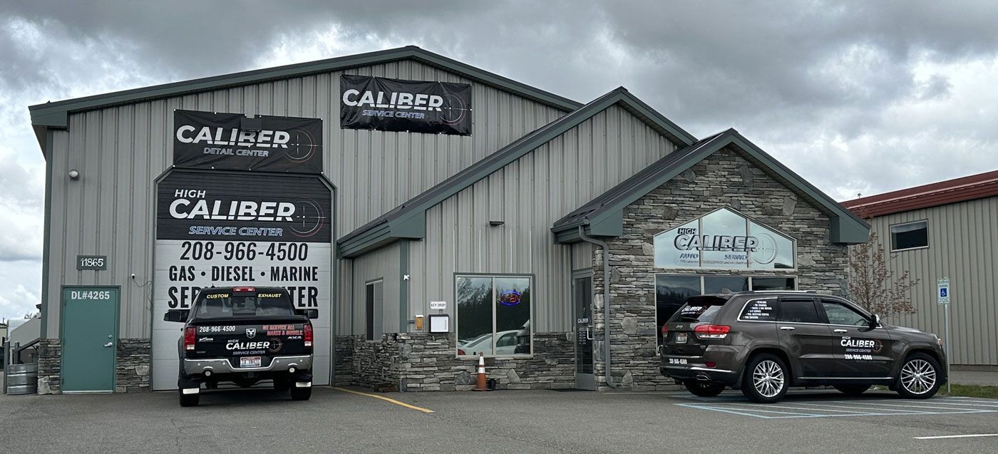 A metal-sided building with stone accents featuring 
