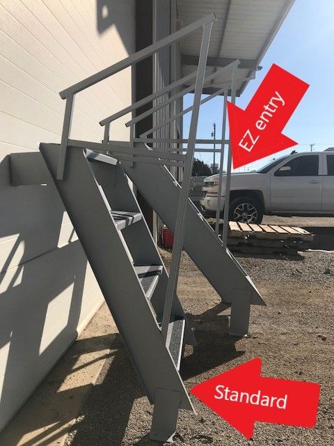 Gray metal staircase leading to a building entry. EZ entry and Standard arrows pointing to features.