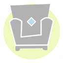 Gray armchair with a light blue diamond, on a pale green background.