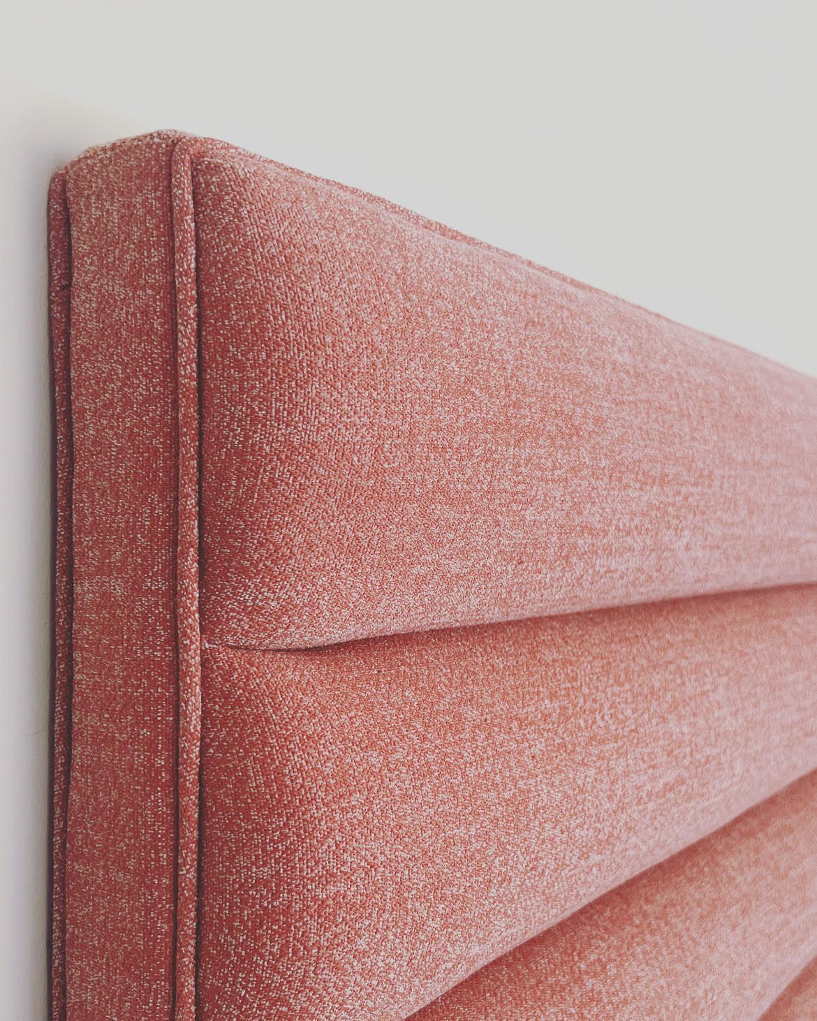 closeup of a soft pink headboard