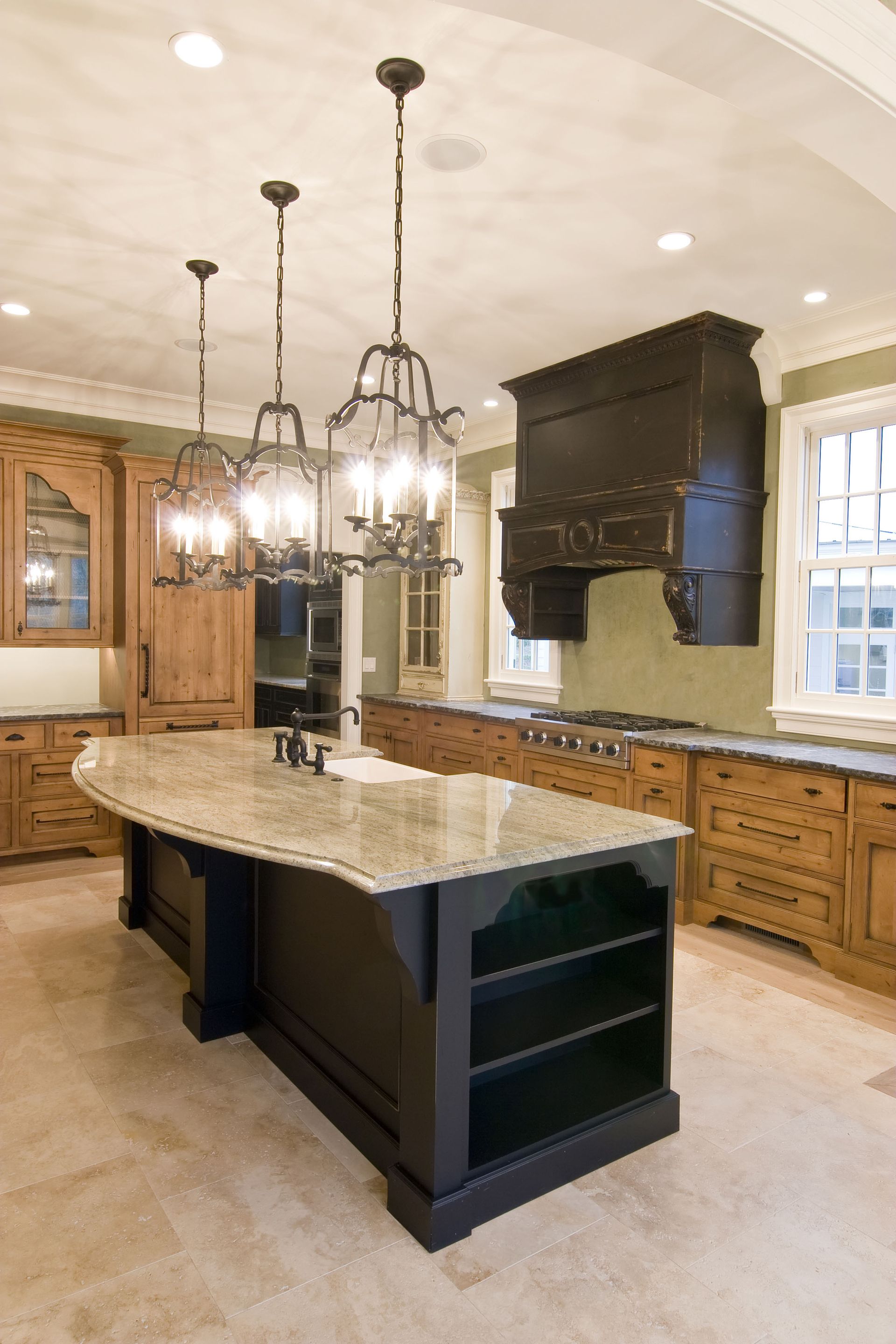 A kitchen with a large island and lots of cabinets