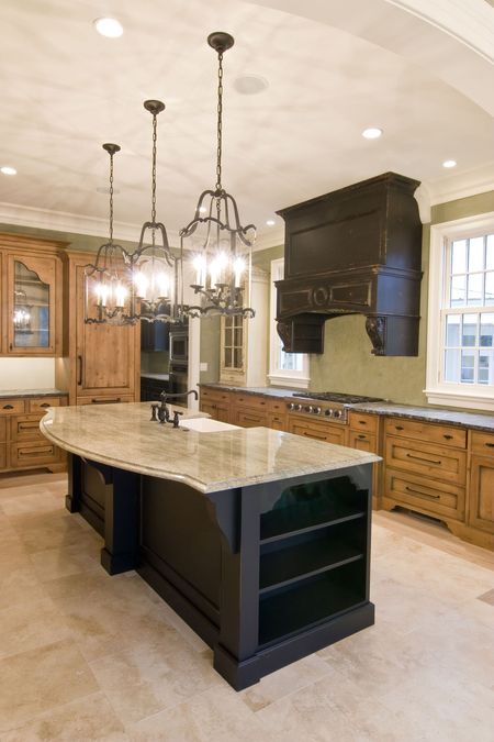 A kitchen with a large island and lots of cabinets