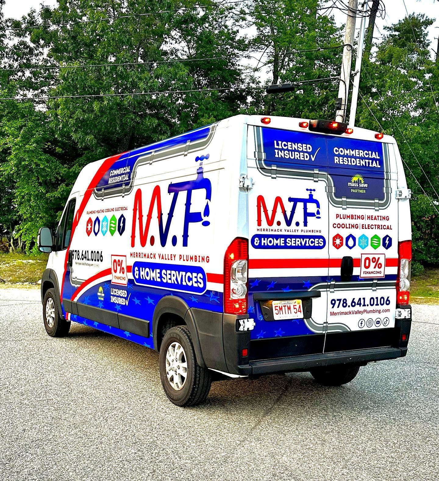 A white and blue MVP Home Services van, with company logo, parked outdoors.