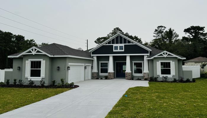 A large house with a driveway in front of it