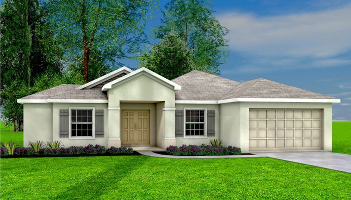 A white house with a garage and a lot of windows is sitting on top of a lush green field.