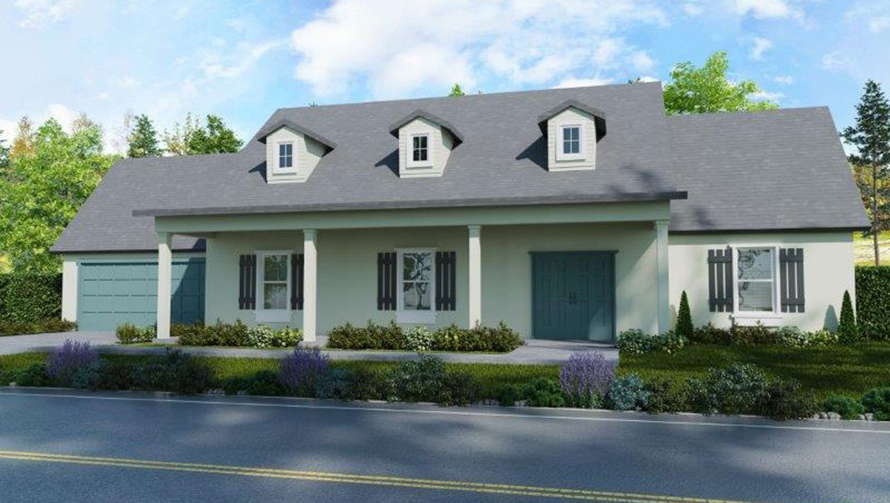 A white house with a gray roof and blue doors