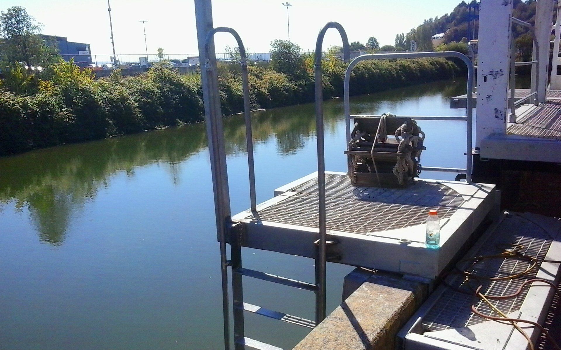 A dock with stairs leading to a body of water