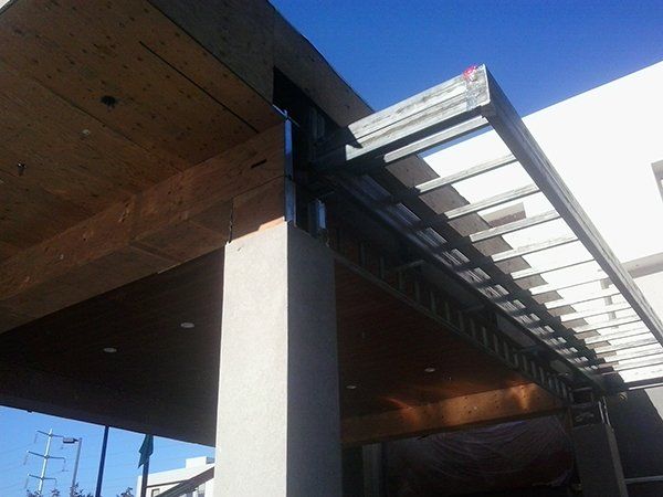A building with a roof that has a canopy over it